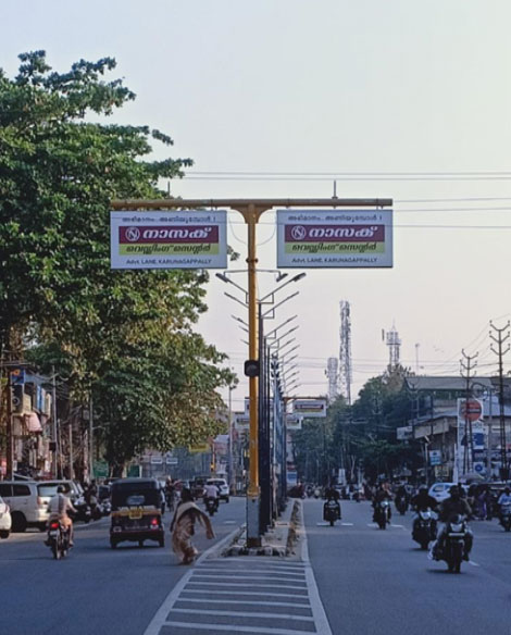 Traffic Signal Blinker Board rates per month, Town – Kollam, Location – Karunagappally Town, Traffic Signal Blinker Lit, Lit/Non Lit – Lit, Size : 8 X 4 Back Lit board, No of Boards: 9, Rate Per Month : 15,000 Per Post