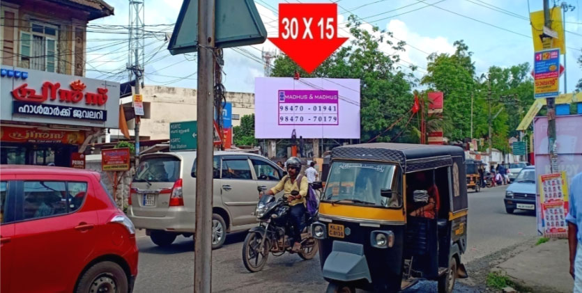 Unipole Hoarding rate list, Town – Thiruvananthapuram, Location – Nedumangad, K S R T C Bus Station, Lit/Non Lit –  Non Lit, Size - 30 X 15 ft, Rate Per Month: Rs. 20,000, Rate For 6 Months: Rs. 1,10,000, Rate For 1 Year: Rs. 2,00,000.